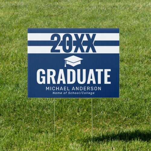 Navy Boy Graduation Lawn Sign - Modern masculine graduation yard sign featuring 2 white sport stripes on a navy blue background that can be changed to any color, a motarboard, and a text template that is easy to personalize.