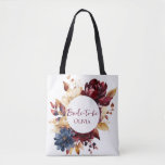 Navy Burgundy Floral Wedding Tote Bag<br><div class="desc">Deep burgundy and rich Navy blue with golden foliage tote bags for Bride-to-be gifts. Trendy romantic design is perfect for all autumn, moody color, jewel toned wedding themes. If you planning an autumn or deeply moody, atmospheric, jewel toned Party celebration, this design is just for you. Customize it for bridesmaid...</div>