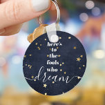 Navy Gold Stars Fools Who Dream Quote Typography Keychain<br><div class="desc">“Here’s to the fools who dream.” Be one of those who always lets their optimism control their vision and aspirations. This rich, modern, graphic, minimalist keychain combines white bold, san-serif typography and handwritten calligraphy script, against a midnight navy denim background sprinkled with faux gold foil stars. This keychain comes in...</div>