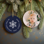 Navy Winter Snowflake First Christmas Keepsake Ceramic Ornament<br><div class="desc">Ceramic holiday ornament personalized with your baby's photo and custom "My First Christmas" text. This simple modern holiday design features a white snowflake on a navy blue background. Use the design tools to choose any background color, edit text fonts and colors and add your own photos to create your own...</div>