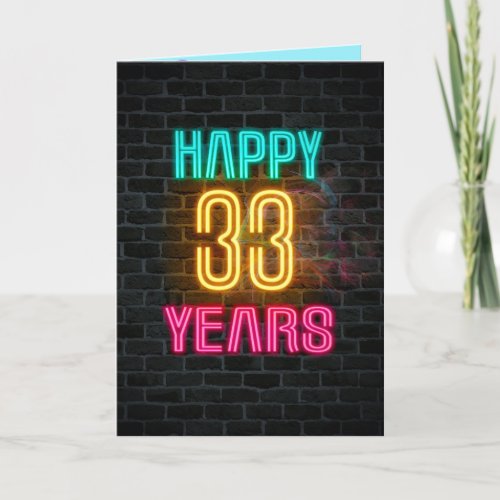 Neon sign on brick for 33rd birthday card