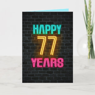 Neon sign on brick for 77th birthday card