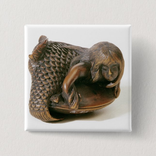 Netsuke carved in the shape of a mermaid button (Front)