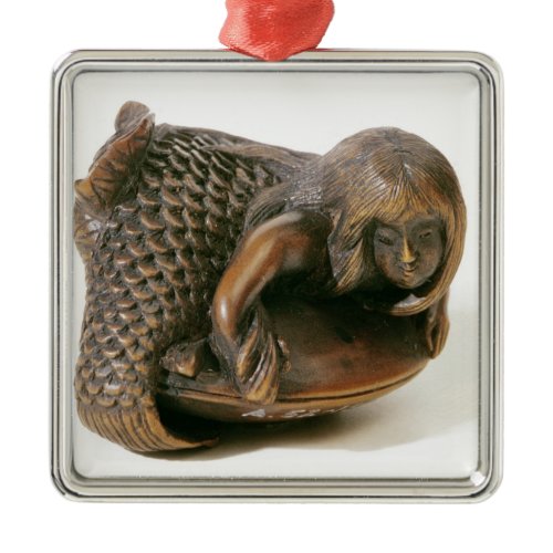 Netsuke carved in the shape of a mermaid metal ornament