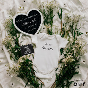 Neutral floral themed pregnancy announcement