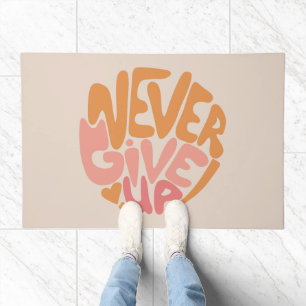 Never Give Up - Blush Pink and Orange Motivational Doormat