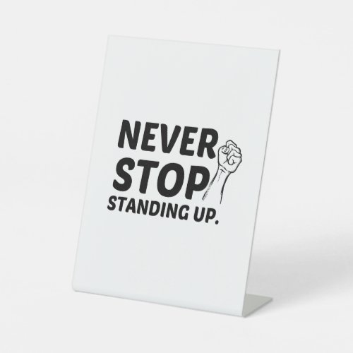 NEVER STOP STANDING UP PEDESTAL SIGN