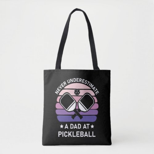 Never underestimate a Dad at Pickleball        Tote Bag