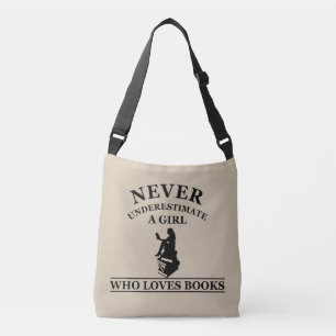 never underestimate a girl who loves books crossbody bag