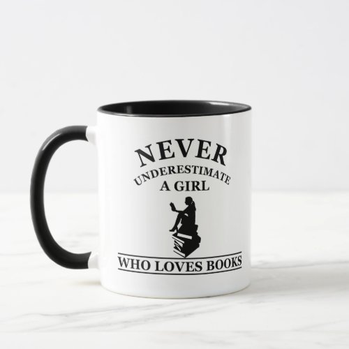 never underestimate a girl who loves books mug