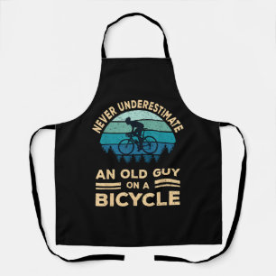 Never Underestimate An Old Guy On A Bicycle Funny  Apron