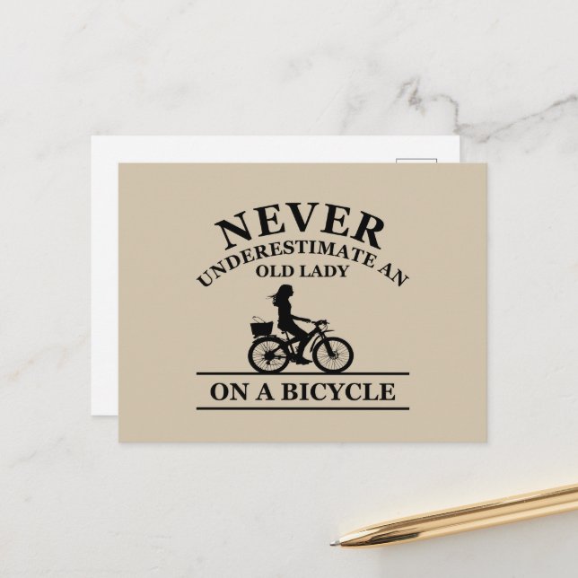 Never underestimate an old lady on a bicycle  holiday postcard (Front/Back In Situ)