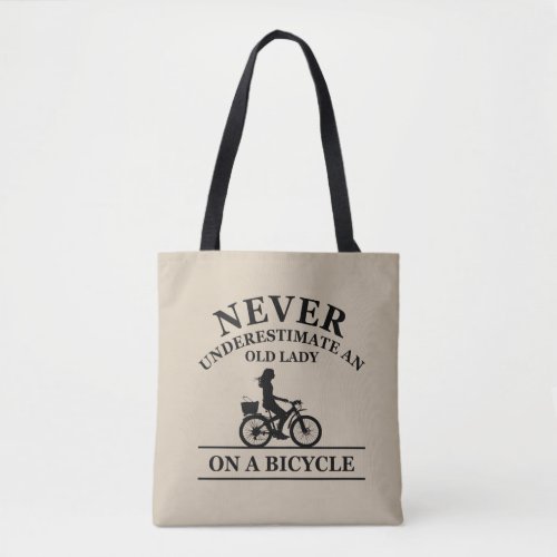 Never underestimate an old lady on a bicycle  tote bag
