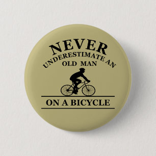 never underestimate an old man on a bicycle button