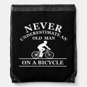 never underestimate an old man on a bicycle  drawstring bag