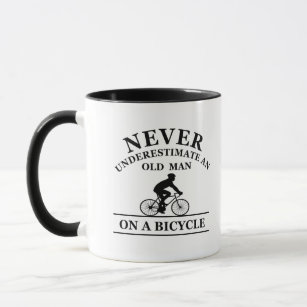 never underestimate an old man on a bicycle mug