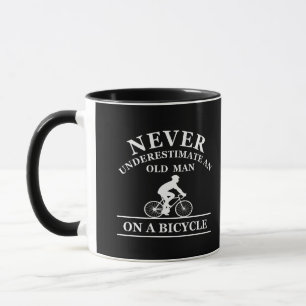 never underestimate an old man on a bicycle mug