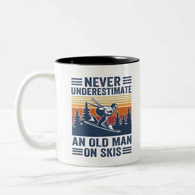 never underestimate an old man on skis Two-Tone coffee mug (Left)