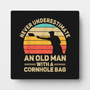 Never Underestimate An Old Man With a Cornhole Bag Plaque