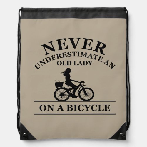 never underestimate an old woman on a bicycle drawstring bag