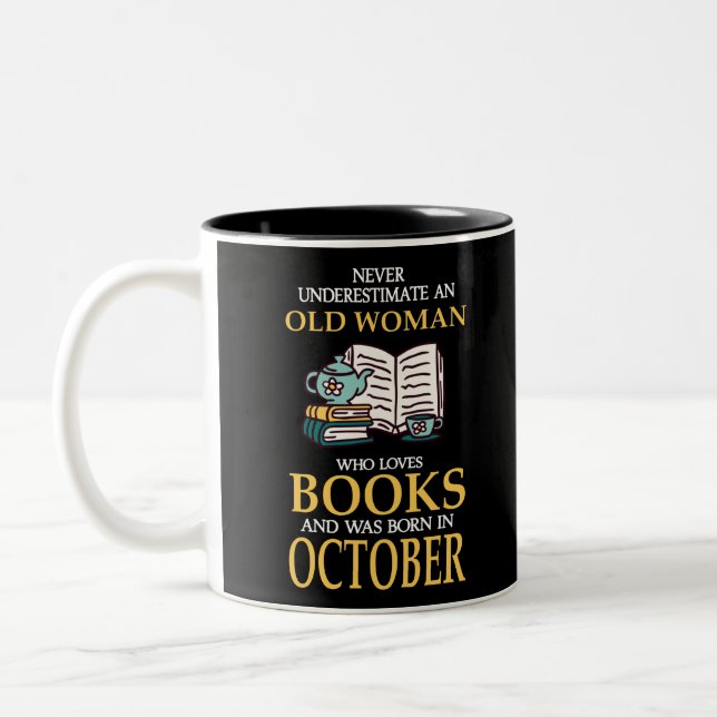 NEVER UNDERESTIMATE AN OLD WOMAN WHO LOVES BOOKS Two-Tone COFFEE MUG (Left)