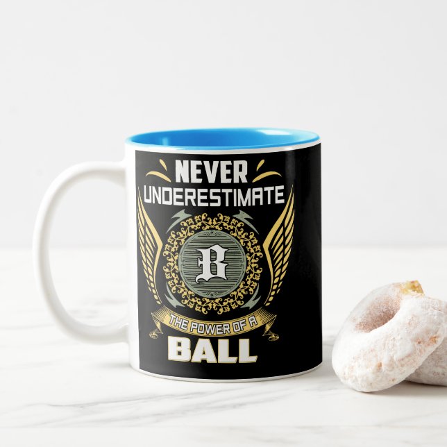 Never Underestimate The Power Of A Ball Two-Tone Coffee Mug (With Donut)