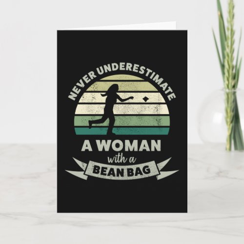 Never underestimate Woman with Bean Bag Cornhole Card