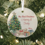 New Parents First Christmas Tree and Crib Glass Ornament<br><div class="desc">Our First Christmas as Mommy & Daddy holiday ornament keepsake. The design features a lit christmas tree with crib and gift wrapped presents. Perfect keepsake gift for new parents celebrating the first christmas with their firstborn child.</div>