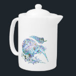 NEW ZEALAND KIWI AND FERN PAUA TEAPOT<br><div class="desc">Classic New Zealand kiwi bird and fern - in the vibrant colors of the Paua shell.

Make pouring yourself that cup of tea and extra pleasure with this vibrant and pleasing design.</div>