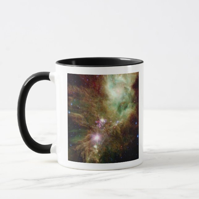 Newborn stars in the Christmas Tree cluster Mug (Left)