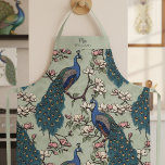 Newlywed Mr and Mrs Floral Peacock Sage Green Apron<br><div class="desc">This Newlywed Mr and Mrs Floral Peacock Sage Green Apron features blue and teal peacocks perched on Magnolia tree branches in full bloom,  hand-drawn in black ink. Elegant sage green background. Personalize with Mr or Mrs and newlywed's last name. All text is editable.</div>