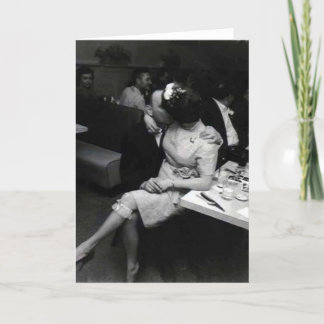 newlyweds kissing at a resturaunt card