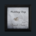 Newlyweds Wedding Day  Gift Box<br><div class="desc">Newlyweds Wedding Day gift box.
Features silver and bronze wedding rings photo as background.
This elegant design can also be personalized with the names of the lucky
couple and the year of marriage.</div>