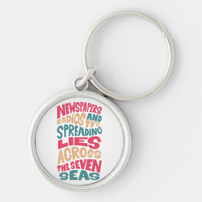Newspapers radios and Tv´s spreading lies across t Keychain (Front)