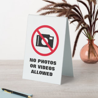 No photos or videos allowed camera warning table tent