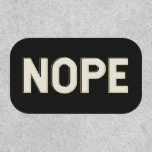NOPE Typography Design Bold Lettering Sassy Patch<br><div class="desc">This patch features a clean, bold text design that captures dry humor in the simplest possible way. The high-contrast black background makes the lettering pop, giving it a modern, graphic look on jackets, backpacks, totes, or gear. Perfect for anyone with a sarcastic streak or a short-and-sweet communication style. A fun...</div>
