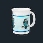 Nordic Folk Art Owl Beverage Pitcher<br><div class="desc">Cute owls in brown and blue,  done in Nordic folk art style,  superimposed on a snowy background image. 

In Norse/Viking mythology owls symbolized wisdom and enlightenment. Modern Scandinavians associate owls with prosperity,  fortune,  and intelligence.</div>
