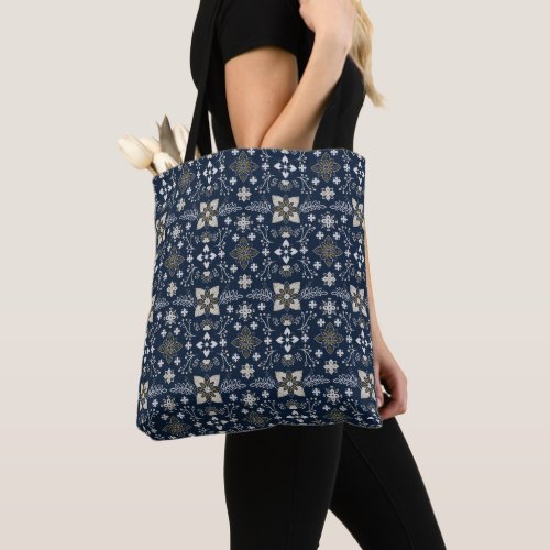 Nordic white and gold flowers on blue background  tote bag