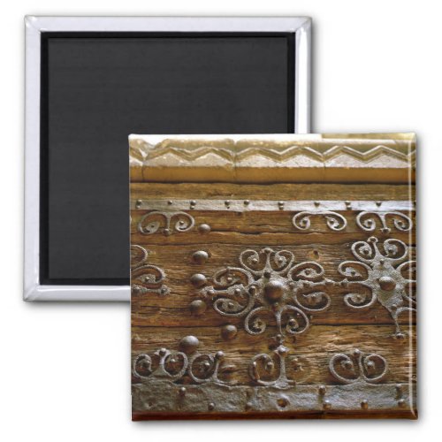 Norman iron scroll work on wooden door magnet