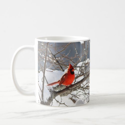 Northern cardinal in the snow coffee mug