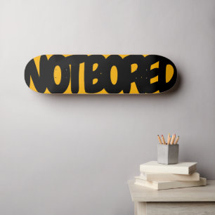 Not Board.  Black letters on orange Skateboard