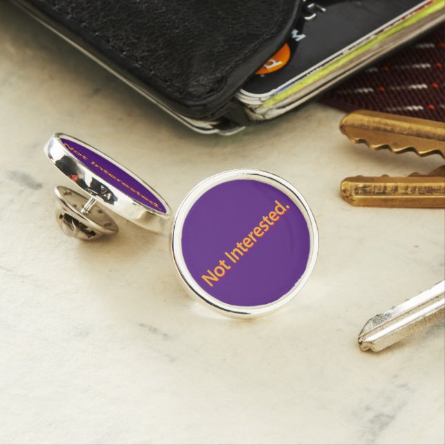 Not Interested. Orange Text Lapel Pin (In Situ)