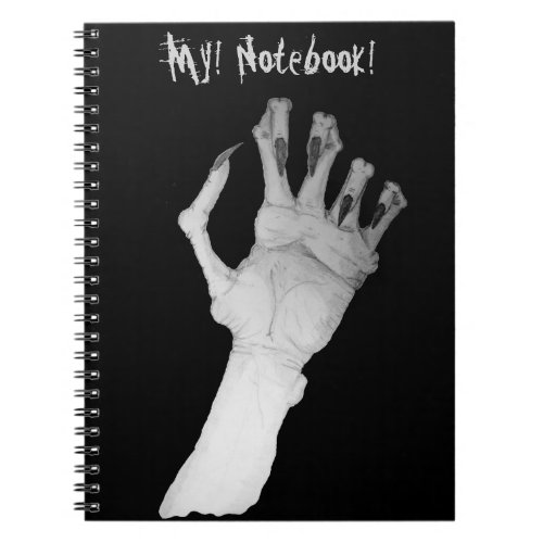 notebook with scary gruesome monster hand