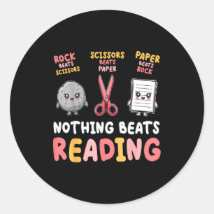 Nothing beats reading funny rock paper scissors classic round sticker