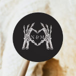 NOVA Halloween Skeleton Heart Hands Wedding Classic Round Sticker<br><div class="desc">The NOVA 'Til Death Wedding Collection features vintage graphite florals,  gothic skulls and skeletons with a festive Halloween inspired font. This collection is perfect for the edgy fall couple. Shop the complete collection for an event that is sure to impress.</div>
