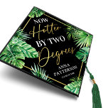 Now Hotter By Two Degrees Graduation Cap Topper<br><div class="desc">Summer graduation cap topper featuring trendy black background,  the saying 'now hotter by two degrees',  tropical watercolor fpalm leaves,  their name,  and class year.</div>
