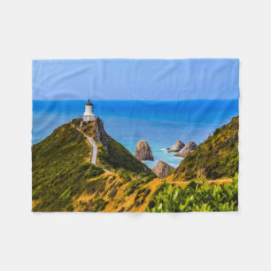 Nugget Point lighthouse, New Zealand Fleece Blanket
