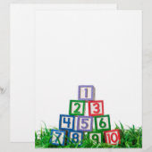 Number blocks stacked on grass (Front/Back)