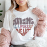 Nurse Nursing is a work of heart Retro Groovy T-Shirt<br><div class="desc">Our Nurse Nursing is a work of heart Retro Groovy t-shirts will bring lots of positivity to your days. Choose the color that best suits you and purchase one to wear yourself or give to a loved one for their Birthday, as a Christmas gift of just because to say how...</div>
