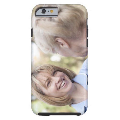 Nurse smiling and talking to a senior woman tough iPhone 6 case